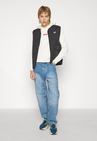 Puma DOWNTOWN PADDED GILET - Smanicato - black