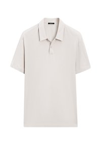 Kortärmad polo skjorta i ljusbeige, tillverkad av slät tyg. Har en traditionell krage, tre-knapps knäppning och sydda detaljer.