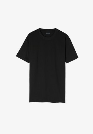 T-shirt noir à manches courtes en coton. Il présente un col rond classique et un design simple et sans embellissement.