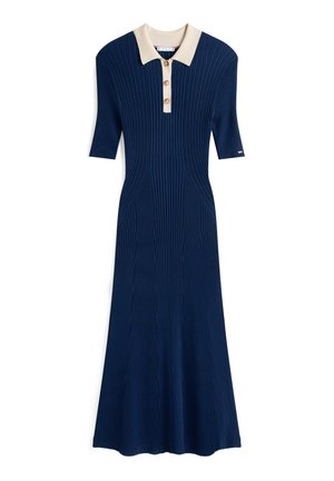 Navy ribbed dress with short sleeves, a cream collar, and three button details running down the front. Flared bottom hem.