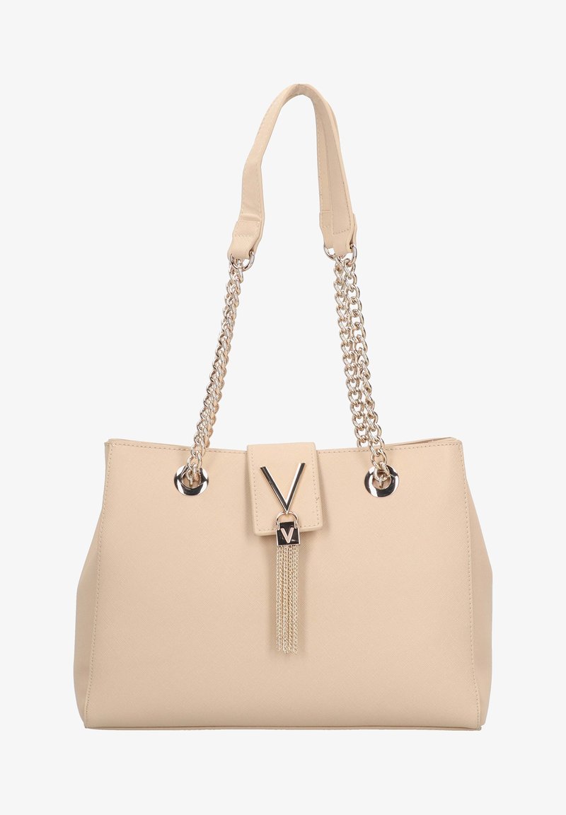 Beige handbag made of textured synthetic material, featuring silver chain straps and a clasp with a V design and tassel detail.