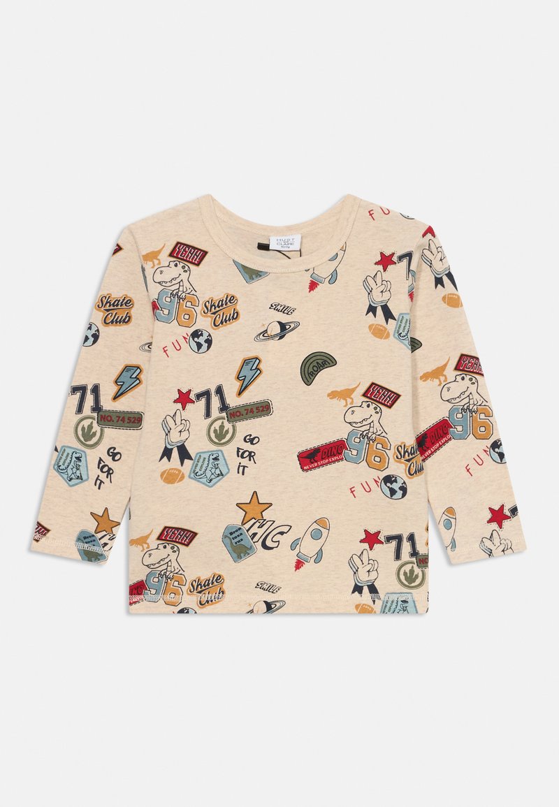 Beige long-sleeve t-shirt featuring various colorful graphic prints, including dinosaurs, planets, and badges, against a soft cotton fabric.