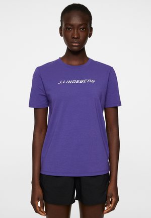 Paarse katoenen t-shirt met korte mouwen met daarop een witte bedrukte logo "J.LINDEBERG" op de borst. Eenvoudig, klassiek crew neck ontwerp.