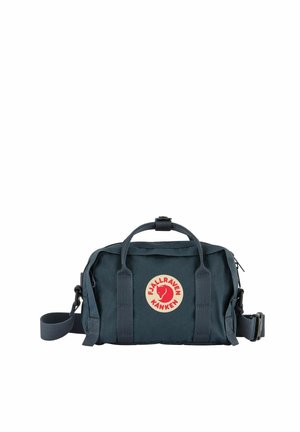 Dark blue Fjällräven Kånken waist bag with dual handles, adjustable strap, and round red logo on the front.