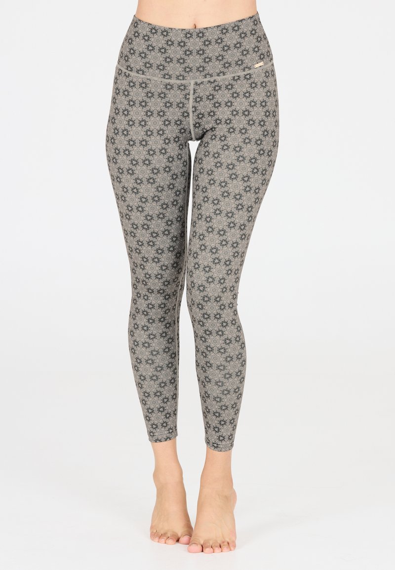 Grijze legging met een hoog tailleband, voorzien van een bloemenpatroon in donkere tinten. Gemaakt van een rekbaar materiaal voor extra comfort.