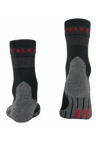 Calze nere e grigie in tessuto testurizzato, con rinforzi sul tallone e sulle punte, e logo "FALKE" rosso sulla banda superiore.