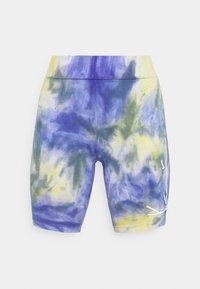 Tie-dye bike shorts in purple, yellow, and green hues. Features an elastic waistband and a white logo accent on the side. Soft, stretchy fabric.