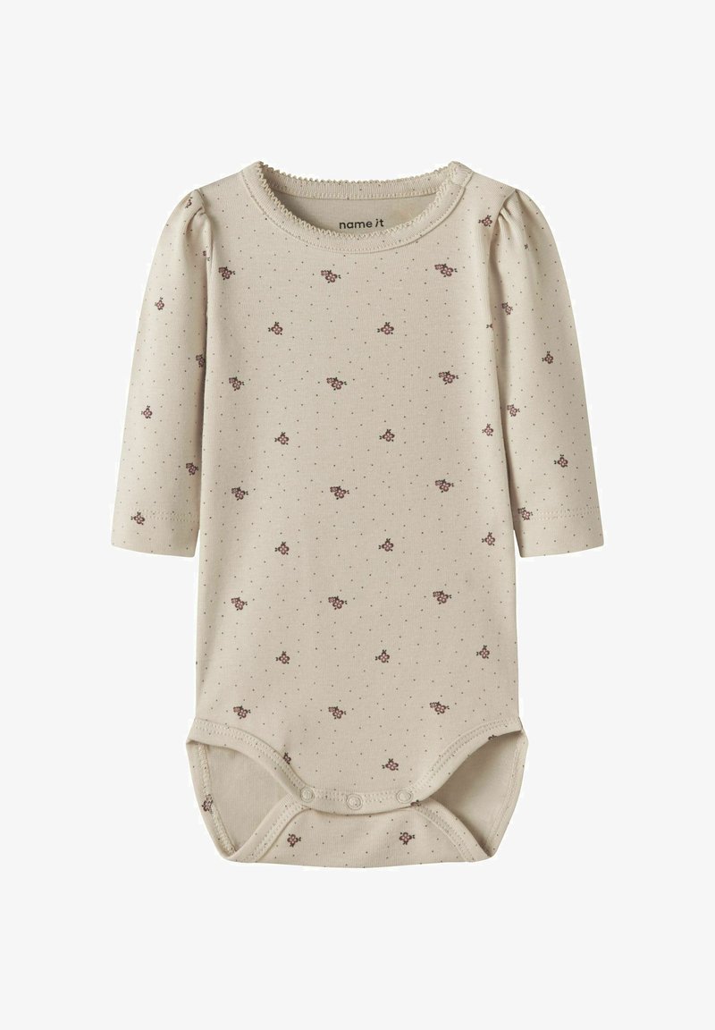 Body bébé beige à manches longues avec petits motifs floraux et pois marron, col rond et pressions à l'entrejambe.