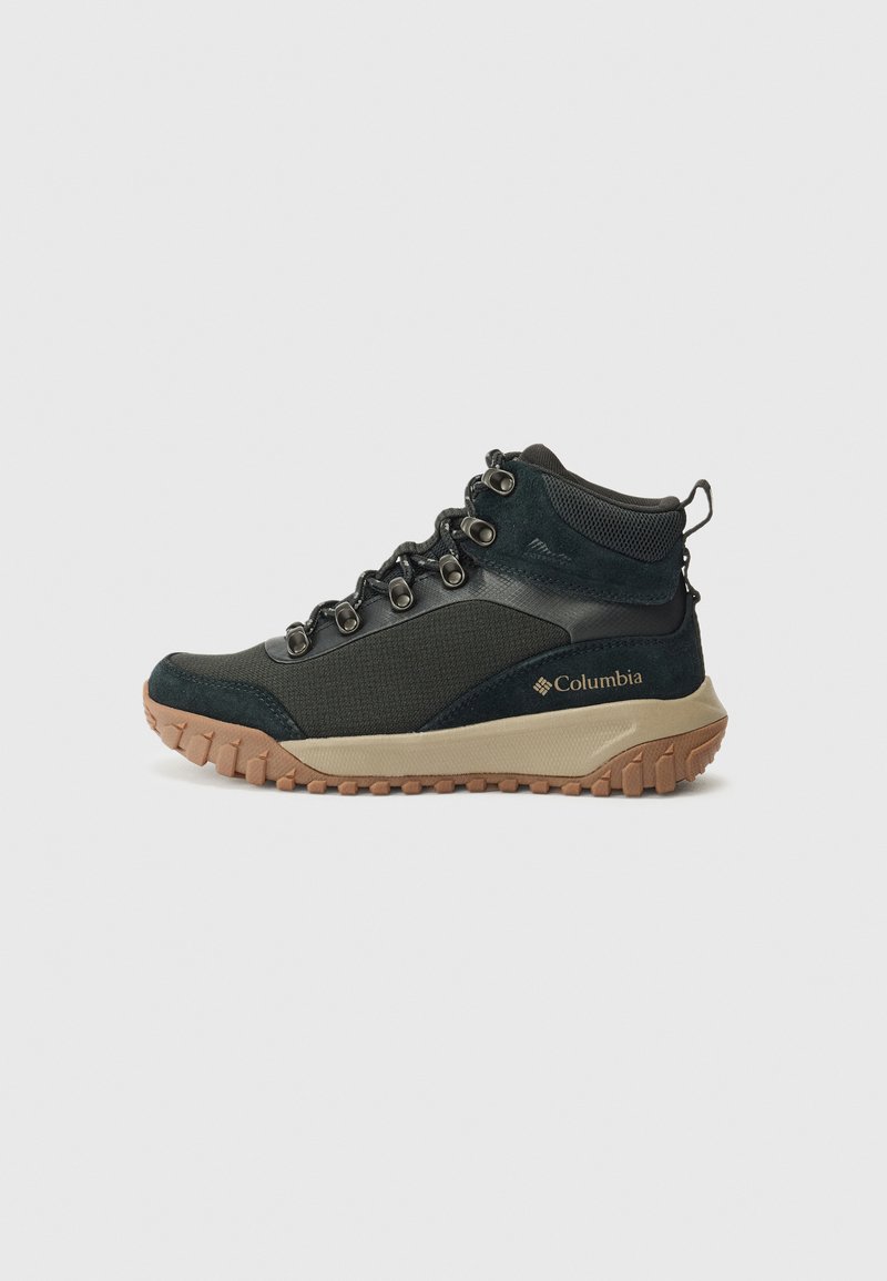 Black and grey hiking boot with laces and rugged sole, featuring the Columbia logo on the side and a cushioned collar for ankle support.