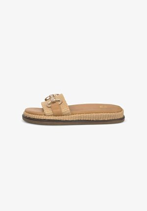 Tan woven slide sandal with a jute sole, featuring a flat design and dual circular metal accents on the strap. Smooth leather insole.