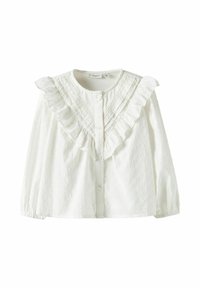 Balta medvilninė palaidinė su raukšlėtu apykakliu, užsegama sagomis ir tekstūruotu raštu su mažais iškilimais. Ilgos rankovės su surinktomis rankogaliais.