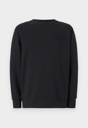 Sweatshirt noir à manches longues, col rond côtelé et logo texturé à l'avant. Fabriqué en tissu doux, avec une coupe décontractée et des ourlets à poignets.