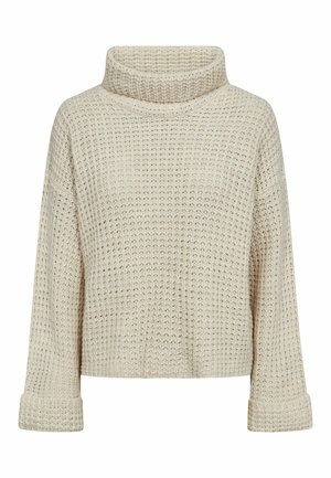 Smėlio spalvos storas megztinis su aukštu apykakliu, ilgomis rankovėmis ir sulankstytais rankogaliais, puoštas tekstūruotu vaflinio rašto raštu.