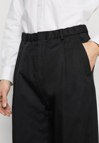 Calvin Klein Kalhoty - black
