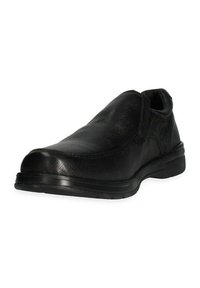 Scarpa slip-on nera in pelle con superficie testurizzata, punta arrotondata e suola in gomma flessibile. Presenta cuciture minime e un design a profilo basso.