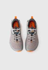 Gray athletic sneakers featuring a textured upper, orange accents, gray laces, a cushioned sole, and an orange inner lining.