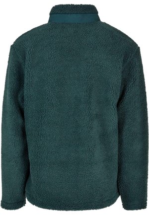 Fleecetröja i mörk teal, med ett mjukt, texturerat tyg, ståkrage och långa ärmar. Inga synliga knäppningar eller mönster.