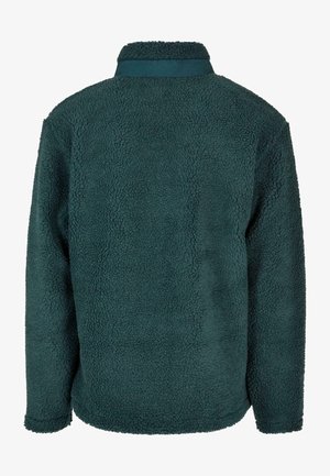 Sötét teal színű fleece pulóver, puha, texturált anyagból, álló gallérral és hosszú ujjal. Nincsenek látható záródások vagy minták.