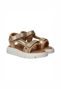 Tan sandalen met gouden glitters, gevoerd voetbed en witte rubberen buitenzool. Voorzien van twee verstelbare klittenbandsluitingen voor een goede pasvorm.