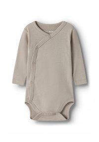 Bež bodi s dugim rukavima s dugmadi za kopčanje, od mekog pamučnog materijala, s krojem nalik ovitku i zaobljenim izrezom. Glatka tekstura, minimalistički stil.