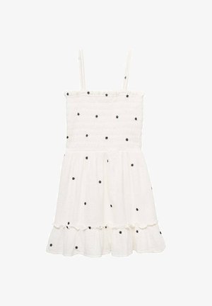 Bela bombažna obleka z črnim cvetličnim vezenjem, nabranim zgornjim delom, tankimi naramnicami in frfotastim robom. Lahka in do kolen.