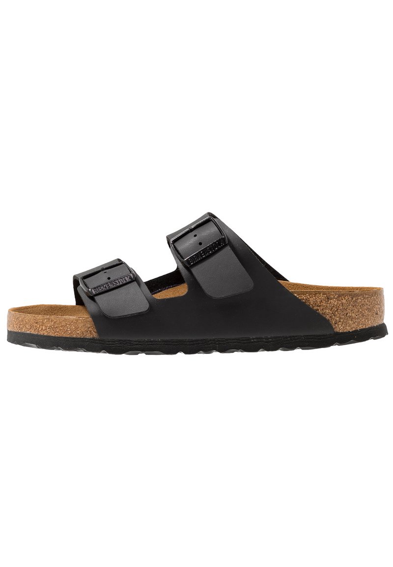 Black slide sandal with two adjustable straps, cork footbed, and textured rubber outsole. Smooth finish on straps and natural texture on cork.