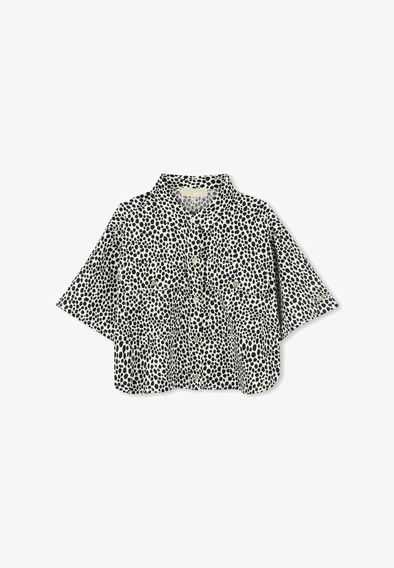 Korte mouwen, colshirt in het wit met een zwart stippenpatroon. Heeft een knoopsluiting aan de voorkant en twee borstzakken. Gemaakt van lichtgewicht stof.