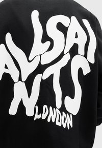 Black sweatshirt featuring white, bold, stylized text "ALLSAINTS LONDON" in an organic, flowing design on the back.