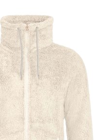 Veste en polaire beige avec col montant, fermeture éclair intégrale à l'avant et deux cordons pendants du col.