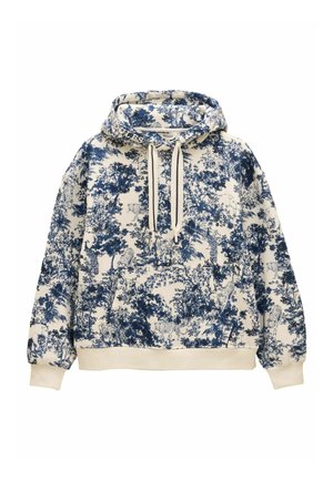 Sudadera con capucha de base marfil y estampado botánico azul. Presenta un bolsillo tipo canguro y puños acanalados con cordones.
