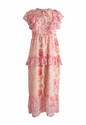 Pink and cream floral maxi dress with ruffled cap sleeves, tiered skirt, and tassel ties at the neckline.