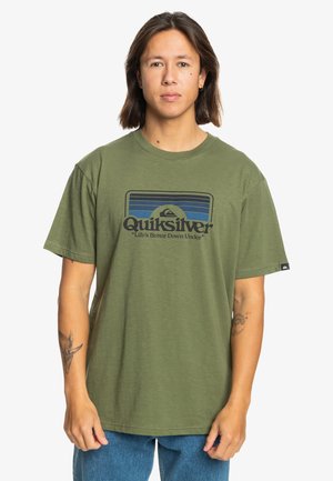 Olive green cotton T-shirt with a crew neck, short sleeves, and a graphic logo design in blue and black featuring mountains and text.