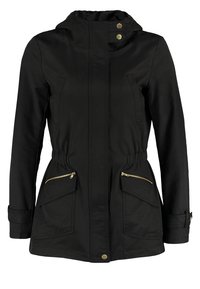 Black parka jacket with a hood, featuring gold-tone hardware, two zippered front pockets, and an elasticized waist for adjustable fit.