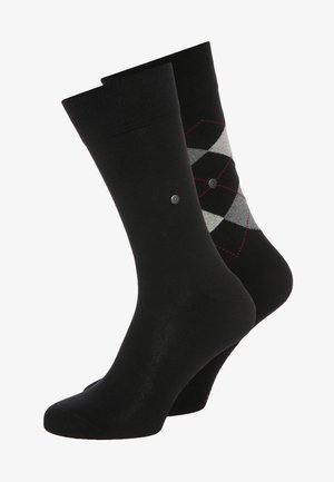Black cotton socks with a smooth texture. One features a diamond pattern in gray and red. The other is solid black.