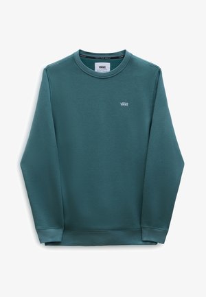Sweat-shirt Vans à manches longues couleur sarcelle avec col rond et petit logo Vans blanc sur la poitrine gauche, posé à plat sur fond blanc.
