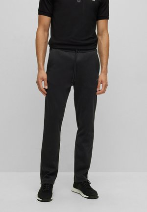 HADIM CURVED - Pantaloni sportivi - black one