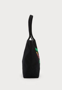 Black canvas tote bag with two long handles, featuring colorful graphic designs on the front, triangular shape with a flat bottom.