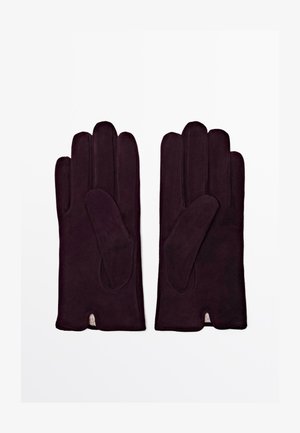 Dark purple gloves made of soft, smooth material, featuring a snug fit, extended length, and a single vented design on each wrist.