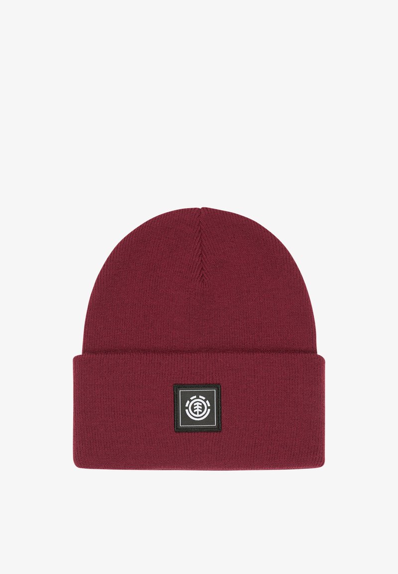 Burgundy knit beanie with a folded cuff and a black square patch featuring a white logo. Soft texture, rounded top, and solid color design.