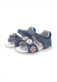 Sandales en denim avec deux brides velcro ajustables, semelles en caoutchouc blanches, et accents floraux roses et blancs. Tige en denim texturée.