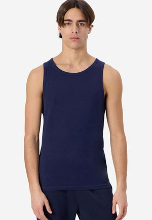 Top senza maniche blu navy in morbido cotone, con scollatura rotonda. Dettaglio logo piccolo in rilievo sul petto.