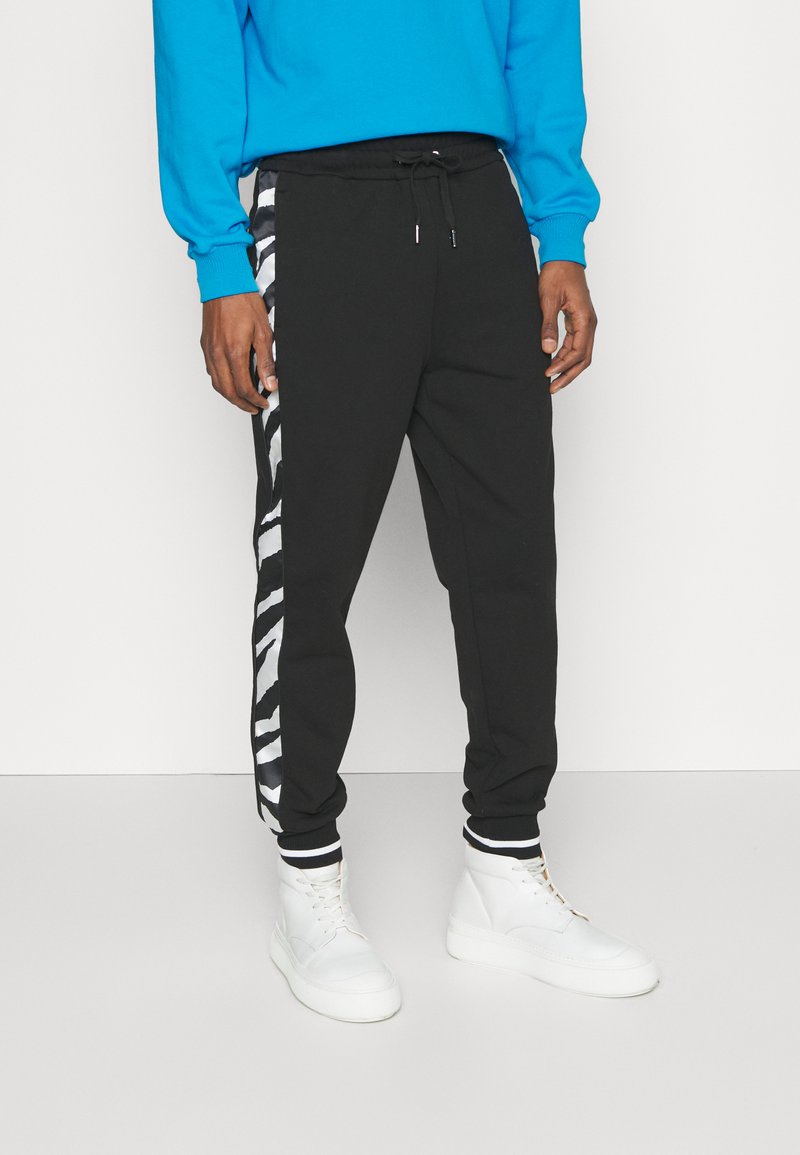 MCM COLLECTION LONG PANTS Tracksuit bottoms black Zalando.de