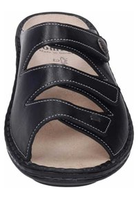 Black leather sandal featuring three wide straps and light stitching, with an open toe and a cushioned insole. Made in Germany.