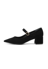 Black suede Mary Jane shoe with a pointed toe, flat black block heel, and an adjustable strap featuring a gold-colored buckle.