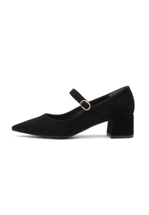 Black suede Mary Jane shoe with a pointed toe, flat black block heel, and an adjustable strap featuring a gold-colored buckle.