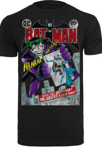 Black cotton t-shirt featuring a vintage comic-style graphic of the Joker and Batman with vibrant colors and retro text accents.