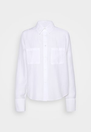 White long-sleeve button-up shirt with collar, two chest pockets, and buttoned cuffs on a plain background.