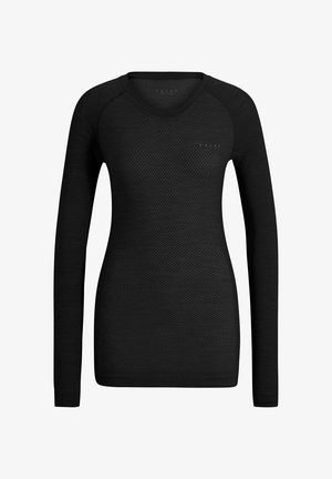 Haut noir à manches longues avec un motif en relief en forme de diamant. Encolure ronde et coupe ajustée. Confectionné dans un matériau léger et respirant.