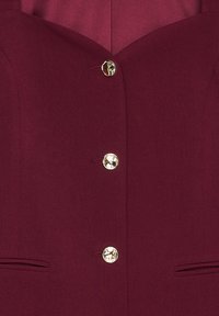 Maroon blazer featuring a fitted design, single gold button closure, and two side pockets. Smooth texture with a structured silhouette.