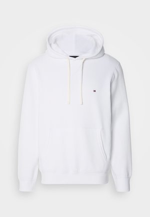 Bílá mikina s kapucí vyrobená z bavlny, s přední kapsou a malým logem. Design zahrnuje šňůrky a ribbed manžety.